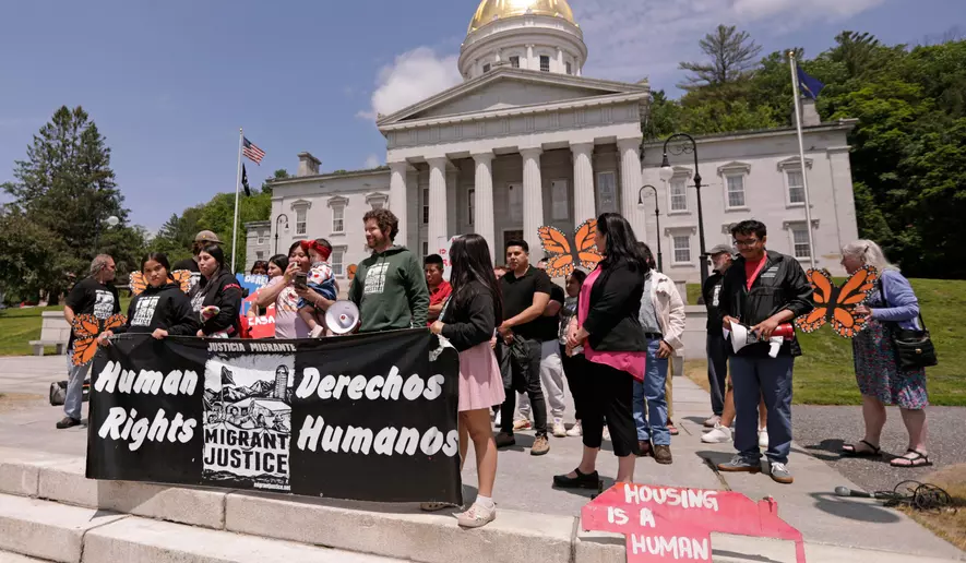 Members of Migrant Justice, a community group advocating for migrant farmworkers’ rights, hold a rally outside the Vermont Statehouse in Montpelier, Vt., on Friday, June 13, 2025. (AP Photo/Amanda Swinhart)