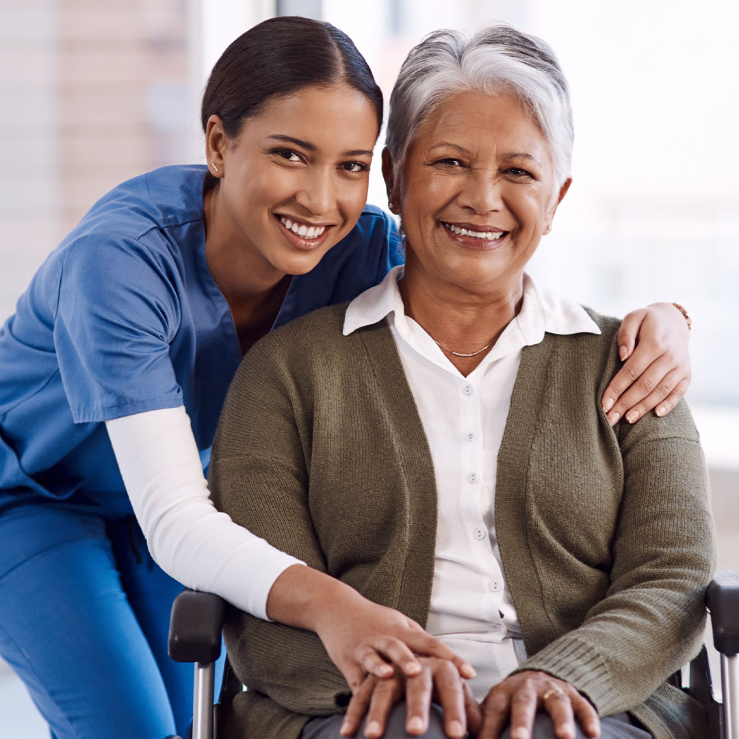 Portrait, smile and nurse with a senior woman in a wheelchair, care and rehabilitation. Face, happy female person and eldery lady with a medical professional, recovery and person with a disability.